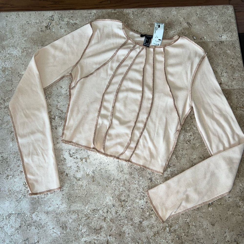 Nude Sunray Seam Ribbed Raw Hem Long Sleeve Crop Shirt - Picture 1 of 6